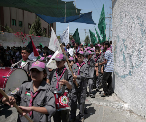 Palestinian children who support Hamas, march in 2015 as they demonstrate against the U.N. relief. (Khalil Hamra/AP)